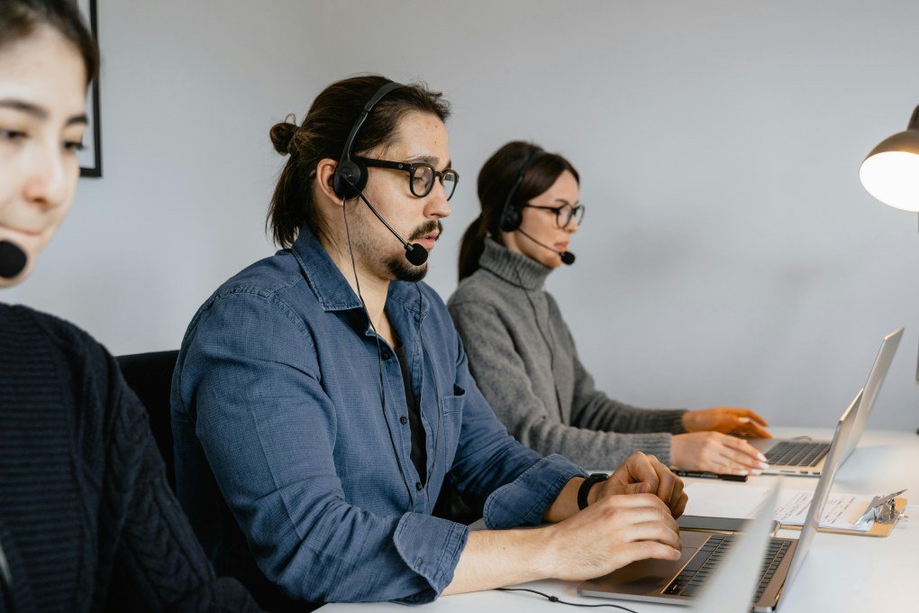 Dedicated ProcurementNation.com support operators handling client calls in modern contact center