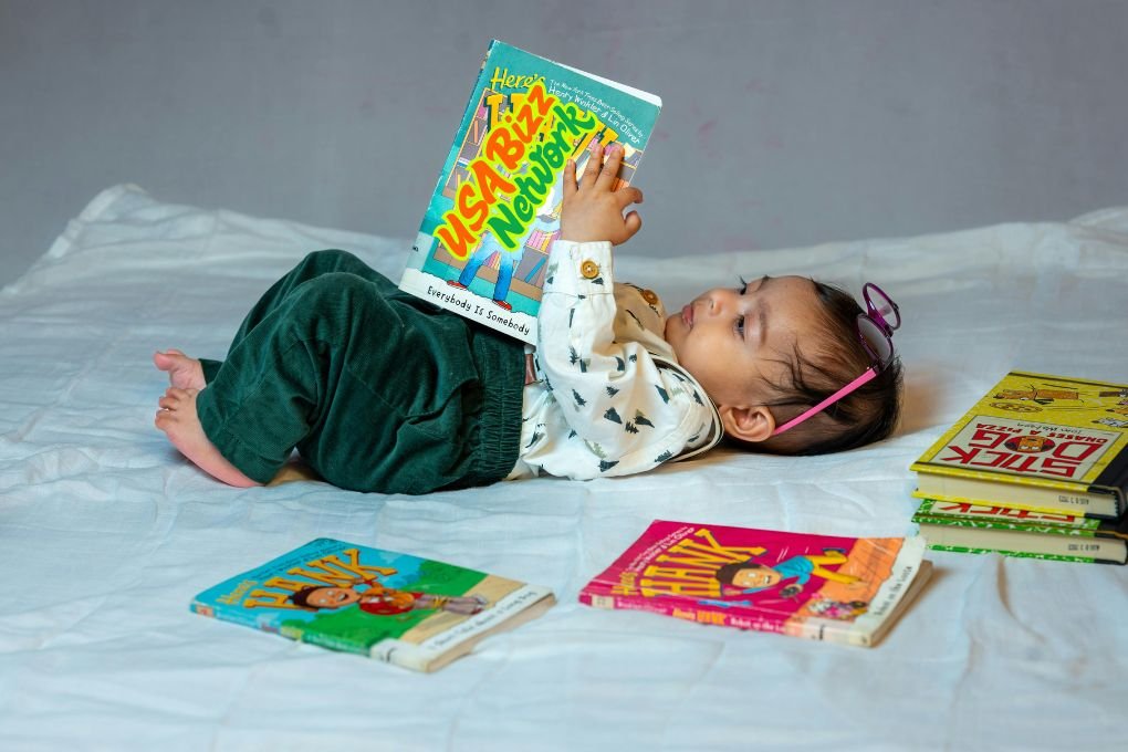 Baby reading books with essential baby and toddler equipment Lumolog