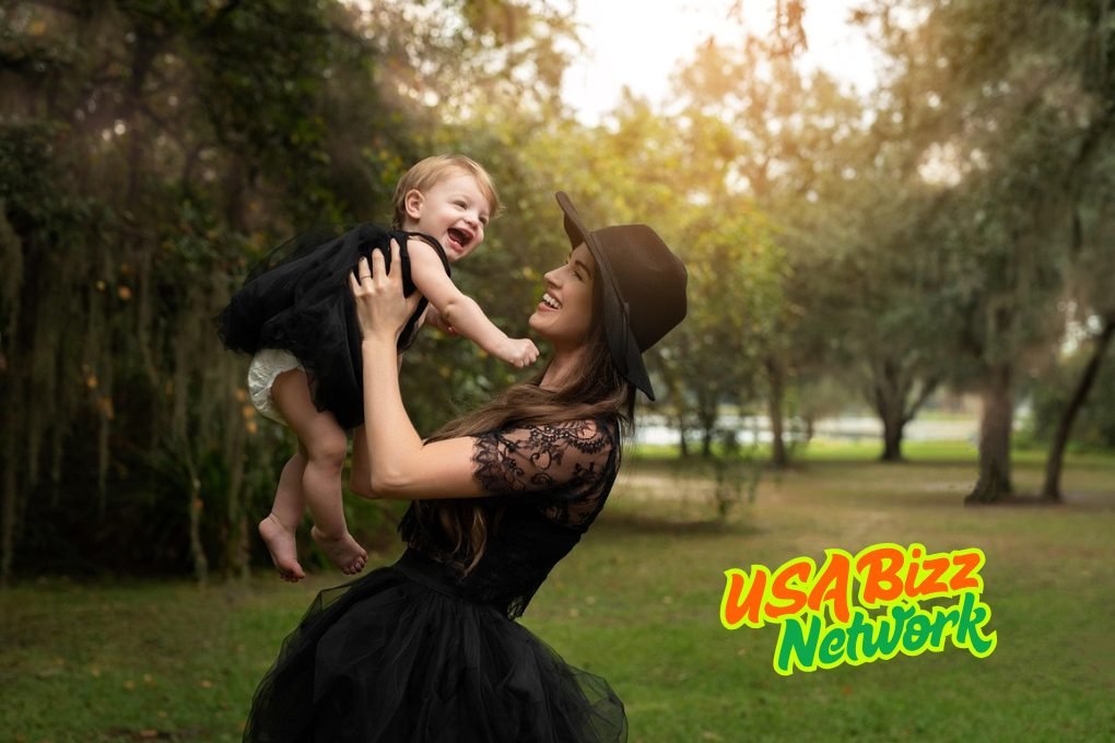 Mom holding baby girl with essential baby and toddler equipment Lumolog