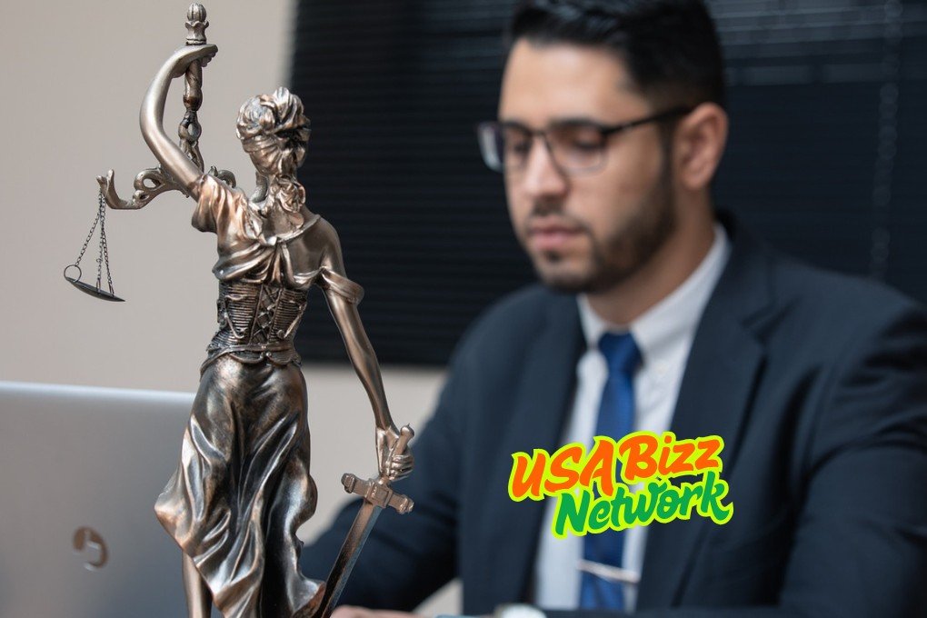 Legal Office Setup – Rochester NY Mesothelioma Attorney Representation Golden justice scale on office desk beside laptop – rochester ny mesothelioma attorney