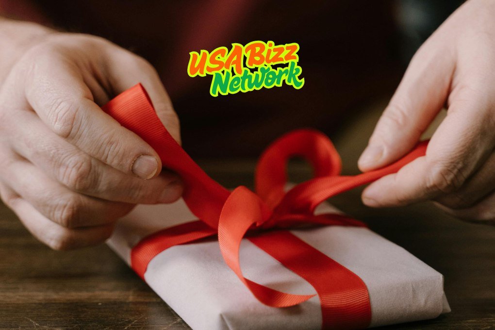 Perfect Gift Ideas for Every Occasion Lumolog - Wrapping a Gift Box with Care Hands wrapping a beautifully decorated gift box - gift ideas for every occasion Lumolog.