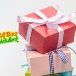 Elegant gift ideas for every occasion Lumolog - A beautifully wrapped gift box with a red satin ribbon