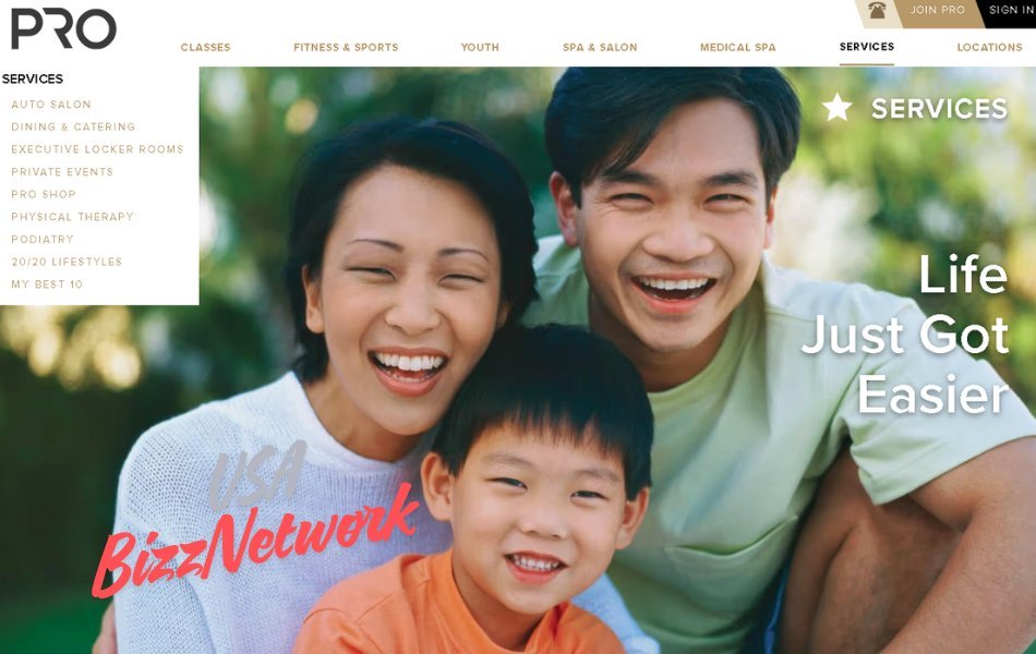 Group of smiling adults at Pro Club Seattle holding fitness equipment during a shared workout session