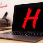 HydraHD red logo on black screen displayed on laptop.