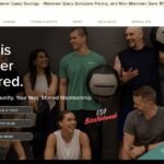 Group of smiling adults at Pro Club Seattle holding fitness equipment during a shared workout session