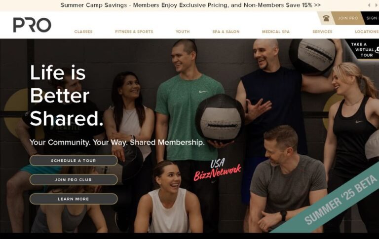 Group of smiling adults at Pro Club Seattle holding fitness equipment during a shared workout session